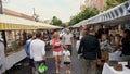 Nice Monday Antique market shoppers passing by.